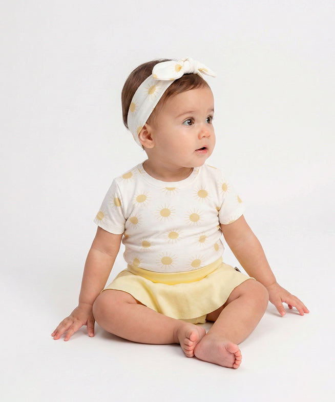 Conjunto-verao-bebe-menina-camiseta-solar-saia-boomies-amarelo-manteiga-faixinha-solar-3_2587646b-d7eb-4c3f-acfa-e7627f16fa52.jpg