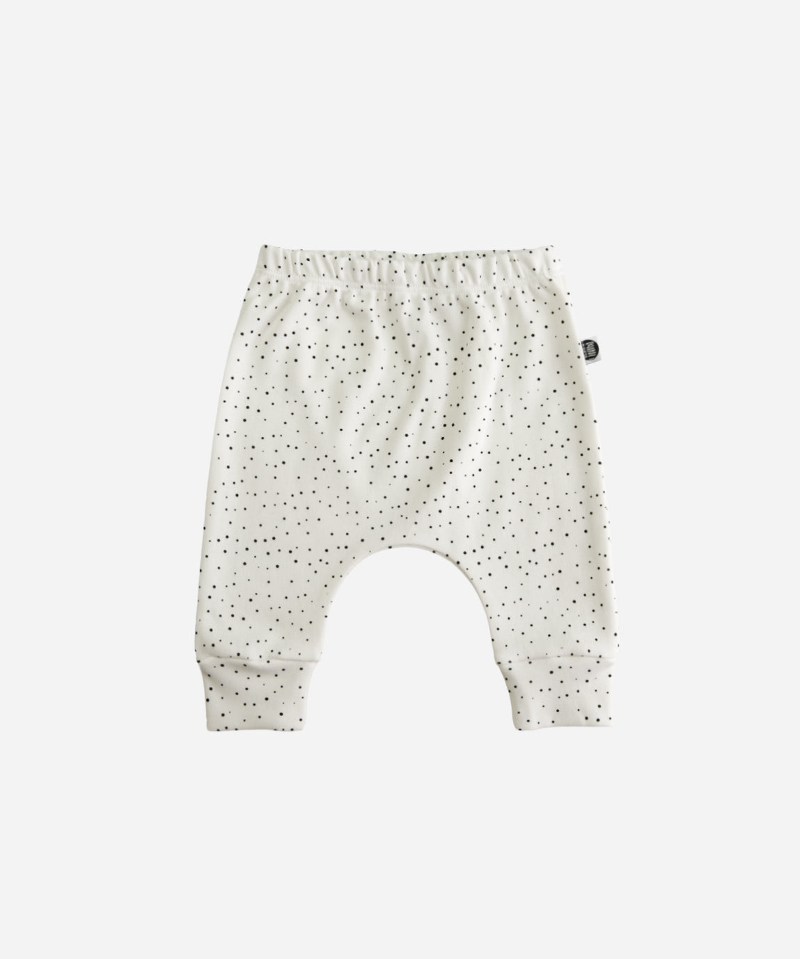 MiniMalista Calça Harém Unissex em Bolinhas Claro, vista frontal. Bolinhas delicadas sobre Branco Off, 100% algodão fio egípcio, modelagem harém. Calça de bebê para menino e menina.