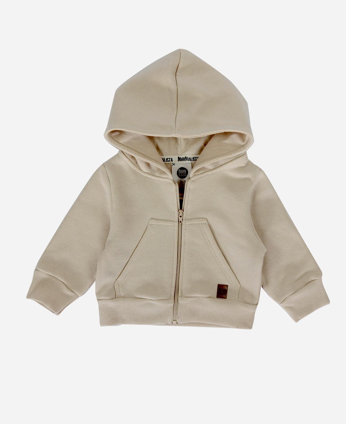 MiniMalista Casaco Moletom Capuz e Zíper Peluciado em Bege Claro. 100% algodão peluciado, com fundo neutro. Casaco infantil para bebê e criança, hoodie unissex menino e menina, do bebê de 0-3 meses aos 5-6 anos.
